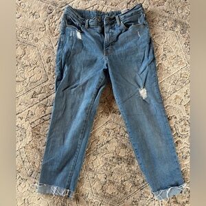 Woman's ankle Distressed Blue Jeans
